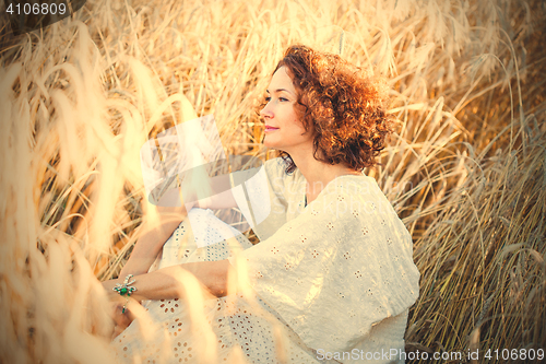 Image of middle aged pretty smiling woman