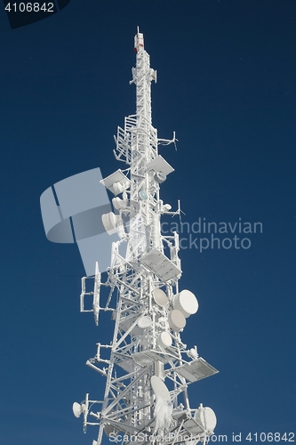 Image of Transmitter tower frozen in winter frost