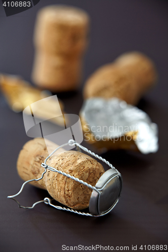 Image of champagne corks on black background