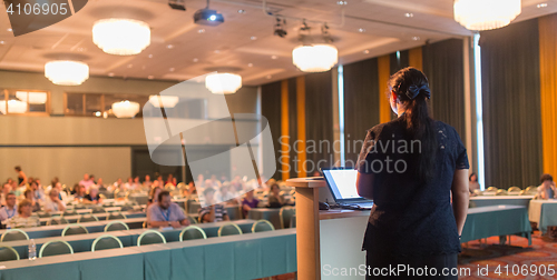 Image of Speaker at Business Conference and Presentation.