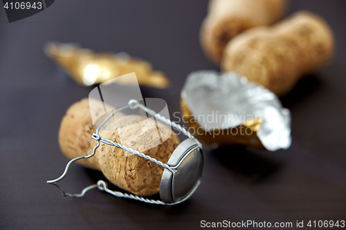 Image of champagne corks on black background