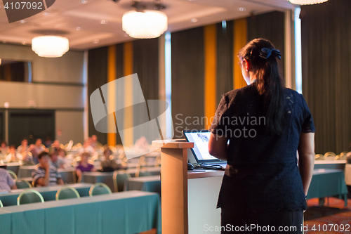 Image of Speaker at Business Conference and Presentation.