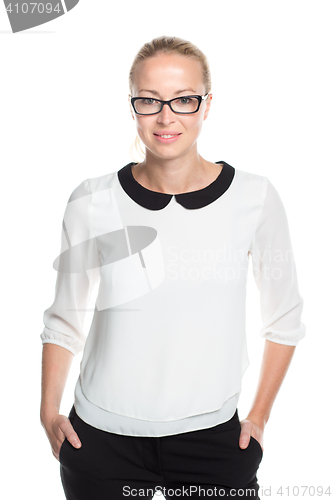 Image of Business woman standing arms in pockets against white background..