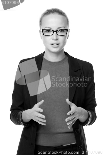 Image of Business woman standing with arms crossed against white background..