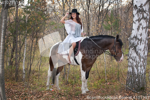 Image of Young Woman And Horse