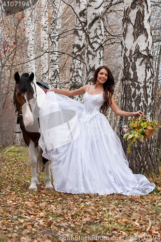 Image of Young Woman And Horse