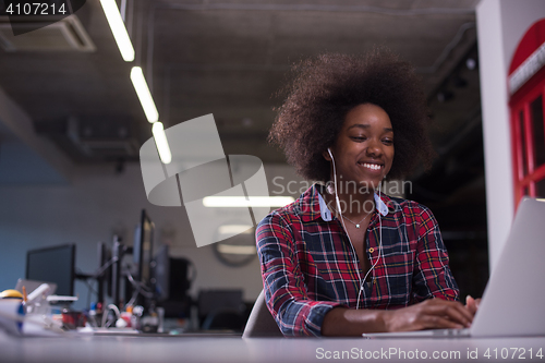 Image of portrait of a young successful African-American woman in modern 