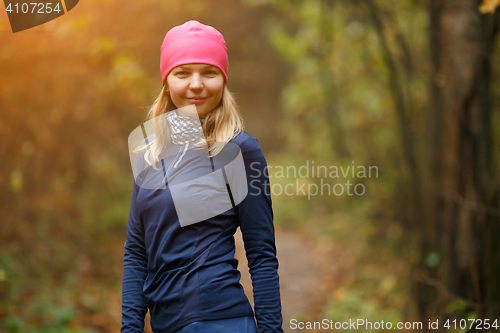 Image of Smiling girl in sport wear