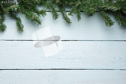 Image of Fir branches decorated white wooden board. Christmas, new year background