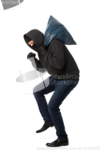 Image of Robber steals with large bag