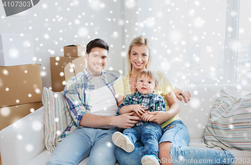 Image of happy family with boxes moving to new home