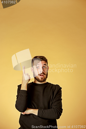 Image of Portrait of young man with shocked facial expression