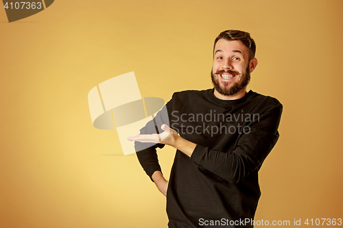 Image of Portrait of young man with happy facial expression