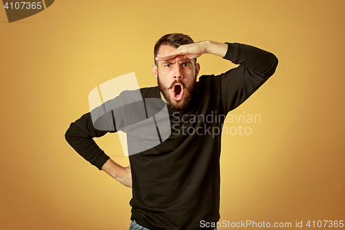 Image of Portrait of young man with happy facial expression