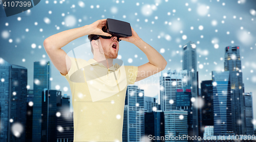 Image of happy man in virtual reality headset or 3d glasses