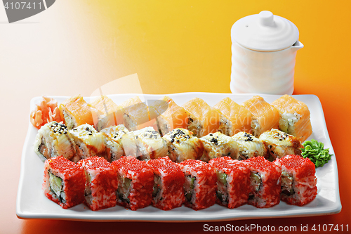 Image of Different sushi rolls and saucer