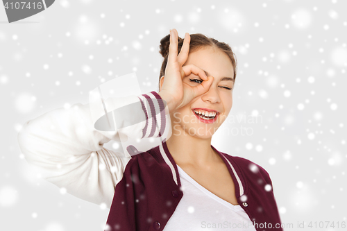 Image of happy teenage girl making face and having fun