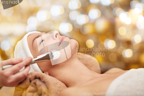 Image of close up of young woman and cosmetologist in spa