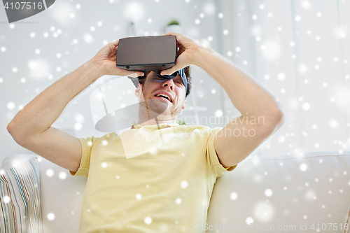 Image of young man in virtual reality headset or 3d glasses