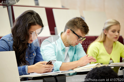 Image of group of students with smartphone at lecture