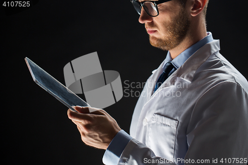 Image of close up of doctor or scientist with tablet pc