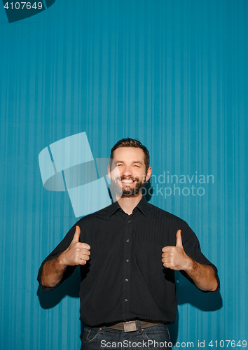 Image of Portrait of young man with happy facial expression