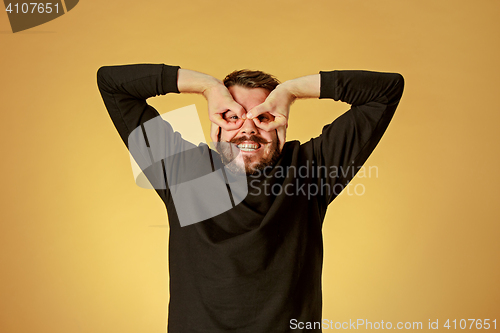 Image of Portrait of young man with happy facial expression