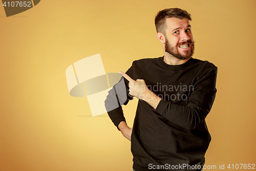 Image of Portrait of young man with shocked facial expression