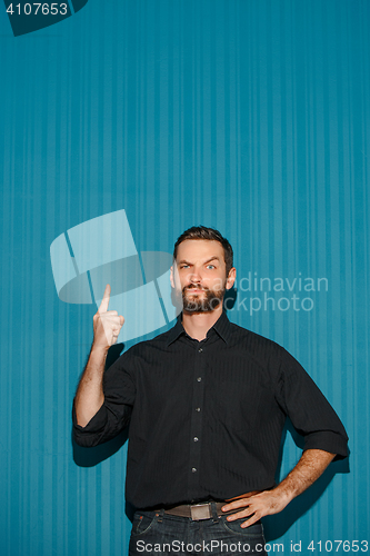 Image of Portrait of young man with serious facial expression