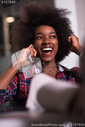 Image of portrait of a young successful African-American woman in modern 