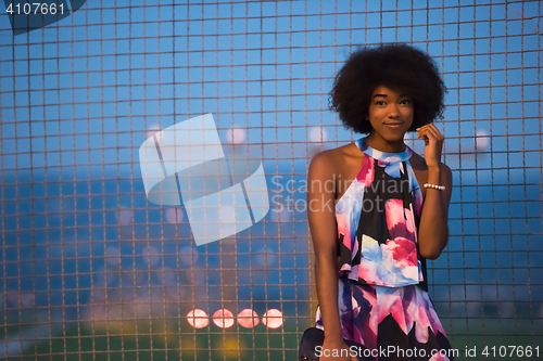 Image of portrait of a young African-American woman in a summer dress