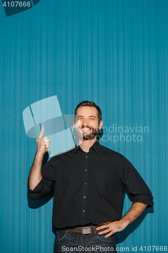 Image of Portrait of young man with happy facial expression