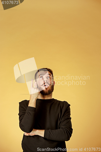 Image of Portrait of young man with shocked facial expression