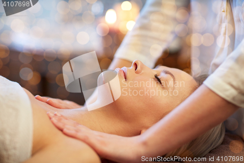 Image of close up of woman lying and having massage in spa