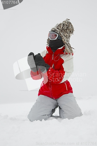 Image of Skier playing with snow