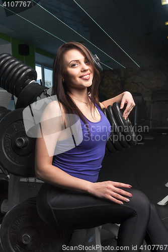 Image of Beautiful fitness woman relaxing