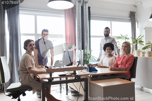 Image of happy creative team in office