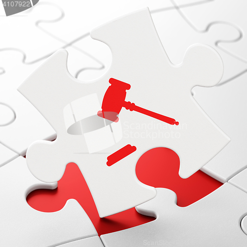 Image of Law concept: Gavel on puzzle background