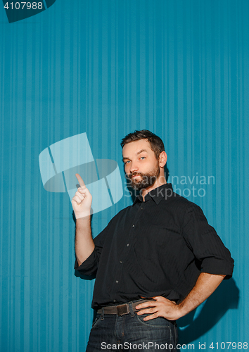 Image of Portrait of young man with happy facial expression