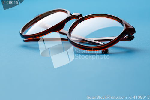 Image of Folded brown spectacles close up
