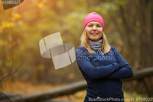 Image of Sport girl in autumn forest