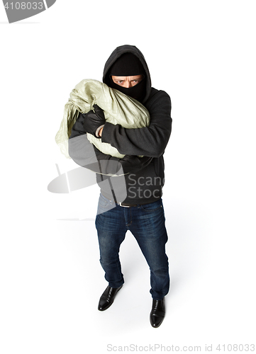 Image of Terrible robber hugging big sack