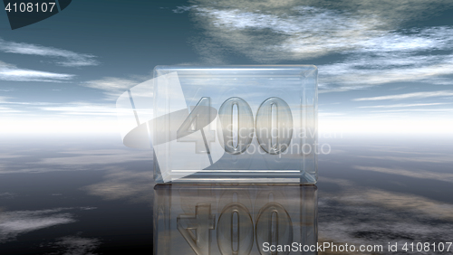 Image of number four hundred in glass cube under cloudy sky - 3d rendering