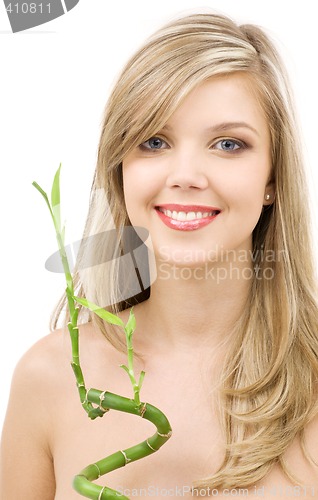 Image of blue-eyed blonde with bamboo