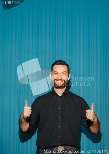 Image of Portrait of young man with happy facial expression