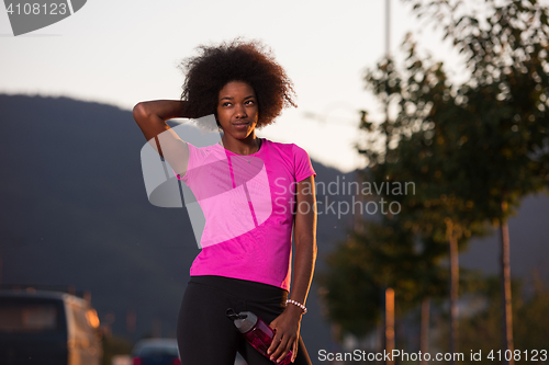 Image of Portrait of a young african american woman running outdoors