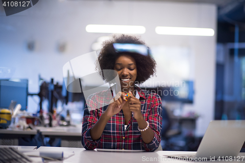 Image of portrait of a young successful African-American woman in modern 