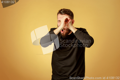 Image of Portrait of young man with happy facial expression