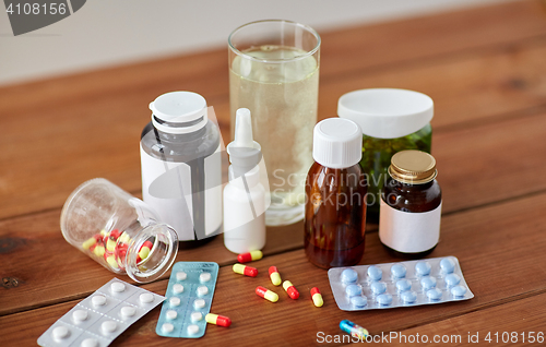 Image of medicine and drugs on wooden table