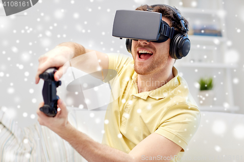 Image of man in virtual reality headset with controller